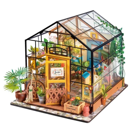 Glass greenhouse model packed with potted plants, tools, and garden decor on a tiled base.