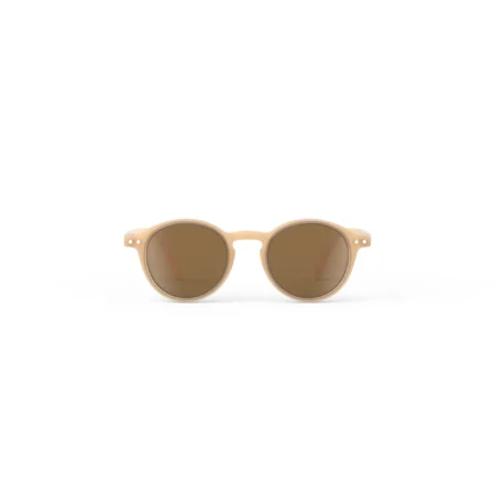 Round beige sunglasses with brown lenses on a white background (product photo).