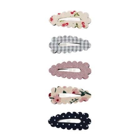 Set of five scalloped fabric hair clips arranged vertically in different patterns and colors, for styling hair
