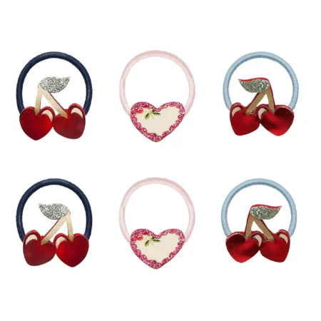 Six decorative hair ties with cherry motifs and a pink glitter heart design, arranged in two rows (three styles repeated).
