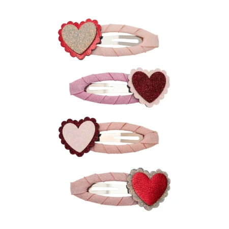 Pink fabric hair elastic with glittery red heart charm on a light background, multiple pieces shown in a row (product image).