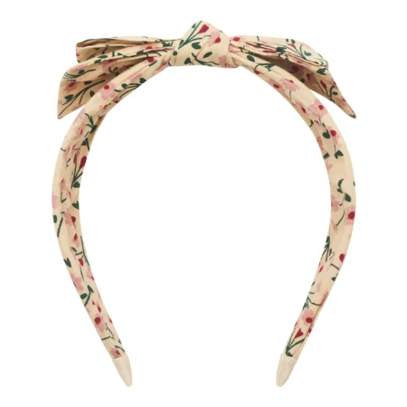 Beige floral headband with a tied bow on top.