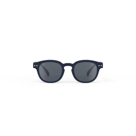 Pair of navy sunglasses with dark lenses on a white background, isolated image of a fashion accessory.