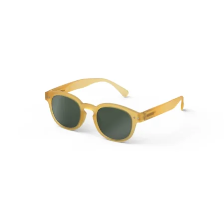 Yellow translucent sunglasses with dark green lenses on a white background.