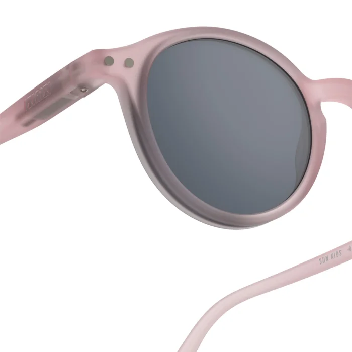 254_699db063b78a8_700x700r Close-up of pink round-frame sunglasses for kids with dark lenses, showing the curved temples.