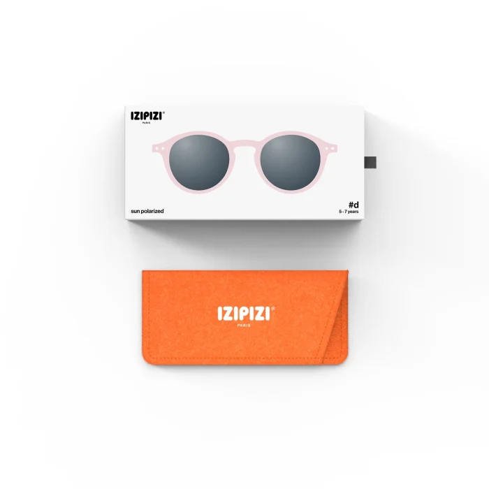 256_699db063f2612_700x700r Pink round-frame sunglasses in a white box labeled IZIPIZI with dark lenses, paired with an orange IZIPIZI case on a light background.