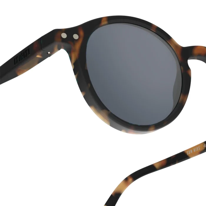 259_699daf5b35358_700x700r Close-up of tortoiseshell round sunglasses with gray lenses; part of the temples is visible.