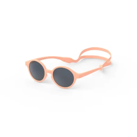 Orange round sunglasses with dark lenses on a white background outside the frame placeholder area in focus on the product lense rims.