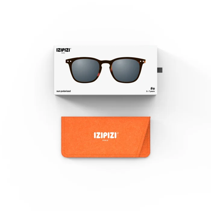 301_699db2ece5008_700x700r Sunglasses with brown frames and blue-gray lenses, in a white IZIPIZI box labeled sun polarized, above an orange IZIPIZI case.