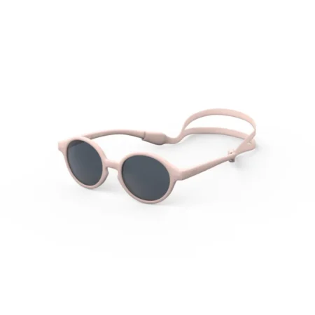 Pink round sunglasses with dark lenses resting on a white background