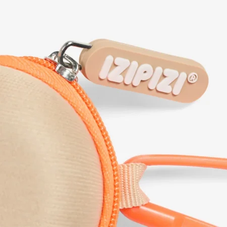 Peach-colored circular pouch with a bright orange zipper and matching strap; the zipper pull shows the IZIPIZI logo.