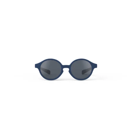 Partial view of blue round-frame sunglasses with dark lenses on a white background