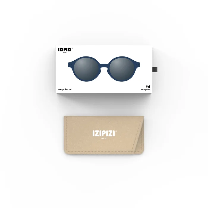 65_699c6a15e4361_700x700r Blue round sunglasses in a white box with IZIPIZI logo and a beige protective case beside it, product shown for sale accessory.