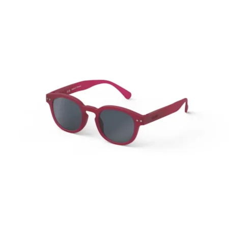 Red sunglasses with dark gray lenses and a rounded rectangular frame on a white background.