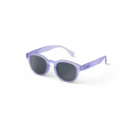 Purple plastic sunglasses with dark lenses on a white background, angled view on a surface.