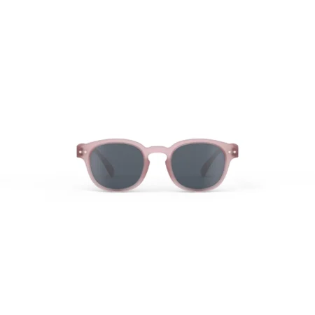 Pink round sunglasses with dark lenses against a white background