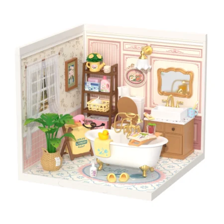 Miniature pink bathroom scene with a clawfoot tub, sink, and shelving filled with bath items and towels.