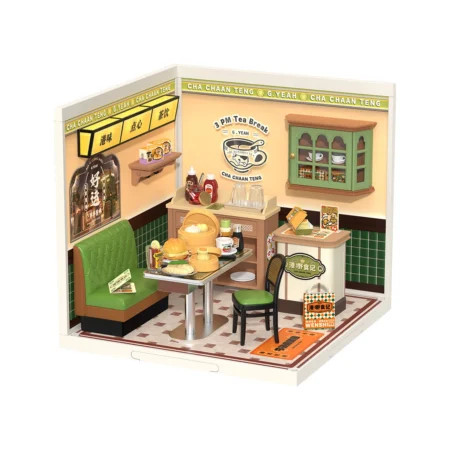 Miniature retro cafe diorama with a green booth, table of pastries, and a tea set on a checkered floor.