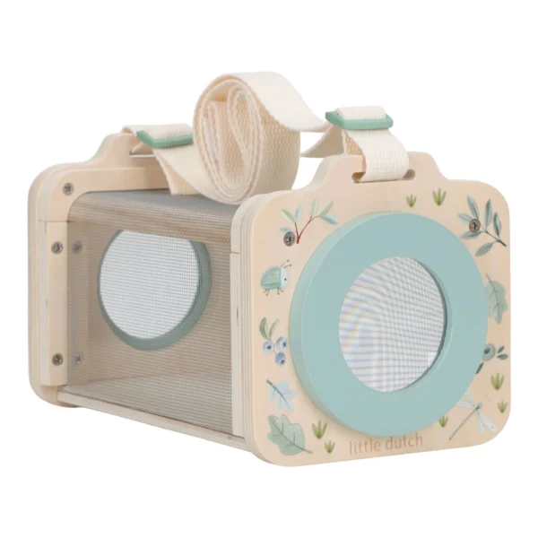 image_40800 Wooden toy camera in beige with a pastel blue circular lens, floral accents, and a fabric strap for play pretend photography.