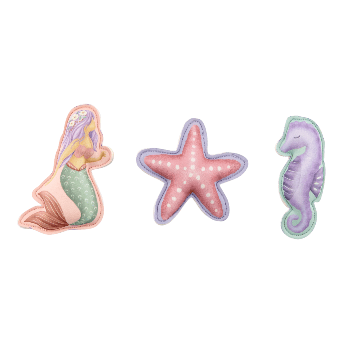 image_41634 Three pastel sea creatures: a mermaid tail plush, a pink starfish with white dots, and a purple seahorse.