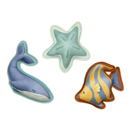 Set of three soft sea creature toys: a blue whale, a green starfish, and a yellow-striped angelfish patch.