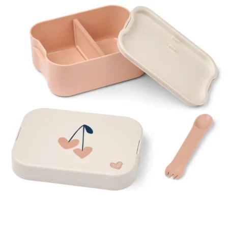 Pastel pink and cream lunchbox set with a two‑compartment box, matching lid, and a small pink fork.