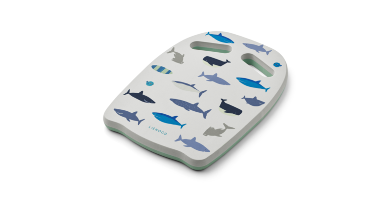 hayden-swim-board-lw15802-2619-shark-dove-blue-1-png White curved cutting board or decorative board featuring blue fish illustrations and two cut-out handles for hanging or grip